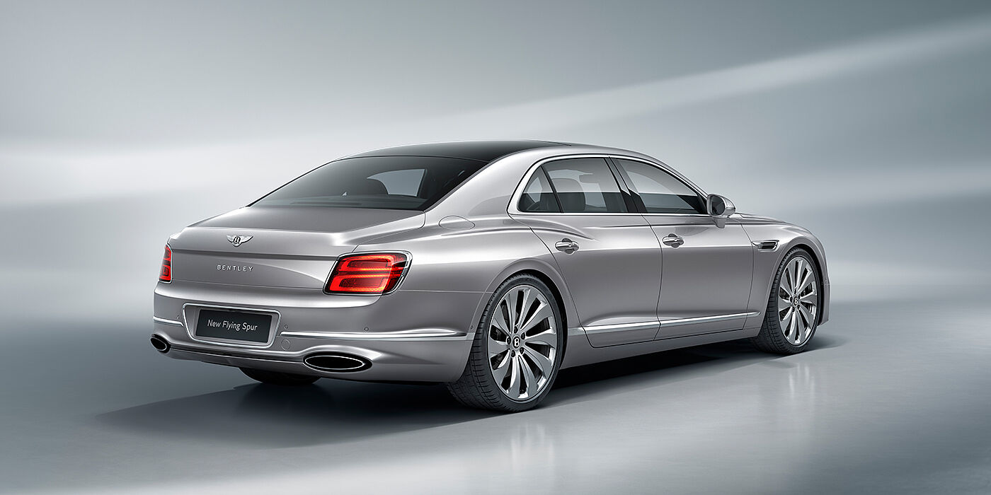 Bentley Cyprus New Bentley Flying Spur sedan rear view in Silverlake paint with ten spoke wheels and chrome matrix grille