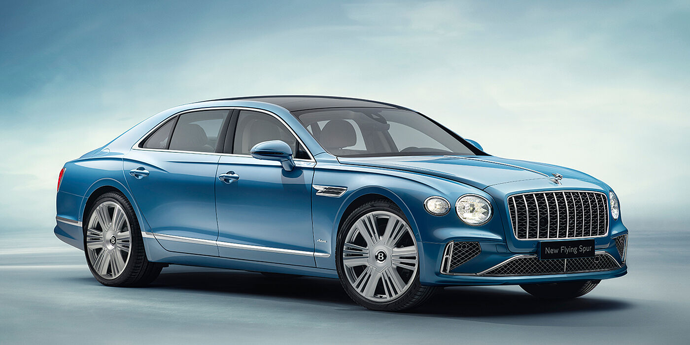 Bentley Cyprus New Bentley Flying Spur Azure sedan front view in Light windsor blue by Mulliner paint with 22 inch Azure wheels and chrome exterior details