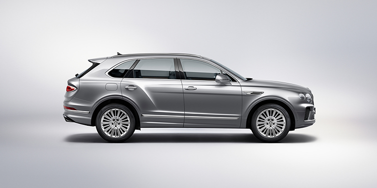 Bentley Cyprus Bentley Bentayga SUV side profile in Moonbeam silver paint against white background featuring 21 inch 5 spoke wheels